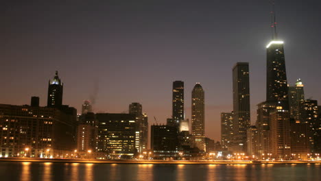 lights brighten as the sky darkens in downtown chicago 1
