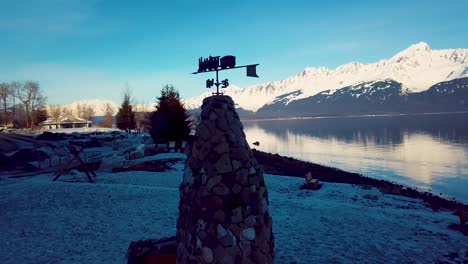 4k drone video of snow covered mountains surrounding seward, alaska during winter