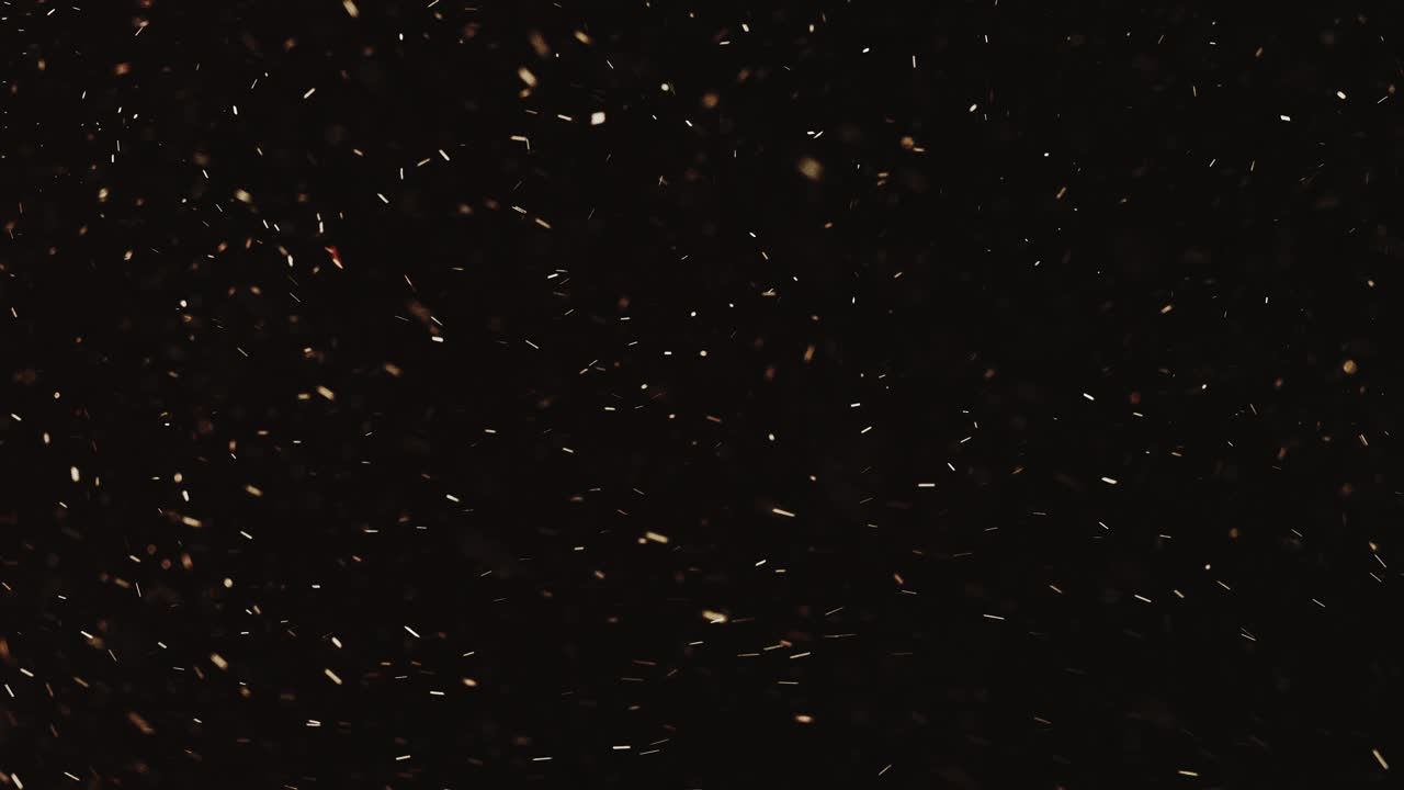 sparks festive background golden particles flying