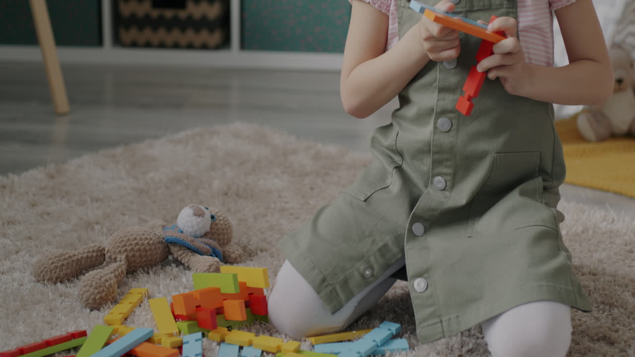 Little Girl Playing with Building Blocks