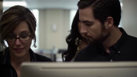 two colleagues collaborate on a project in a contemporary office environment. their focused discussion reflects teamwork and dedication in achieving professional goals.