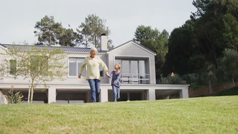 grandmother and little girl holing hands and running 4k 4k