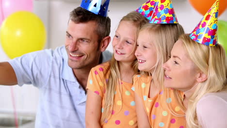 family taking picture at a party