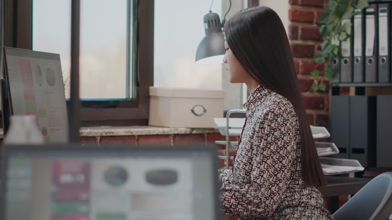 Close up of woman working on business startegy with computer