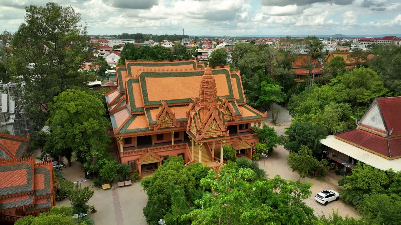Wat Bo temple historical landmark with city skyline and lush greenery