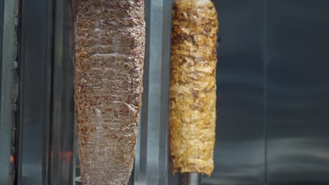 döner kebab and shawarma meats on vertical spits