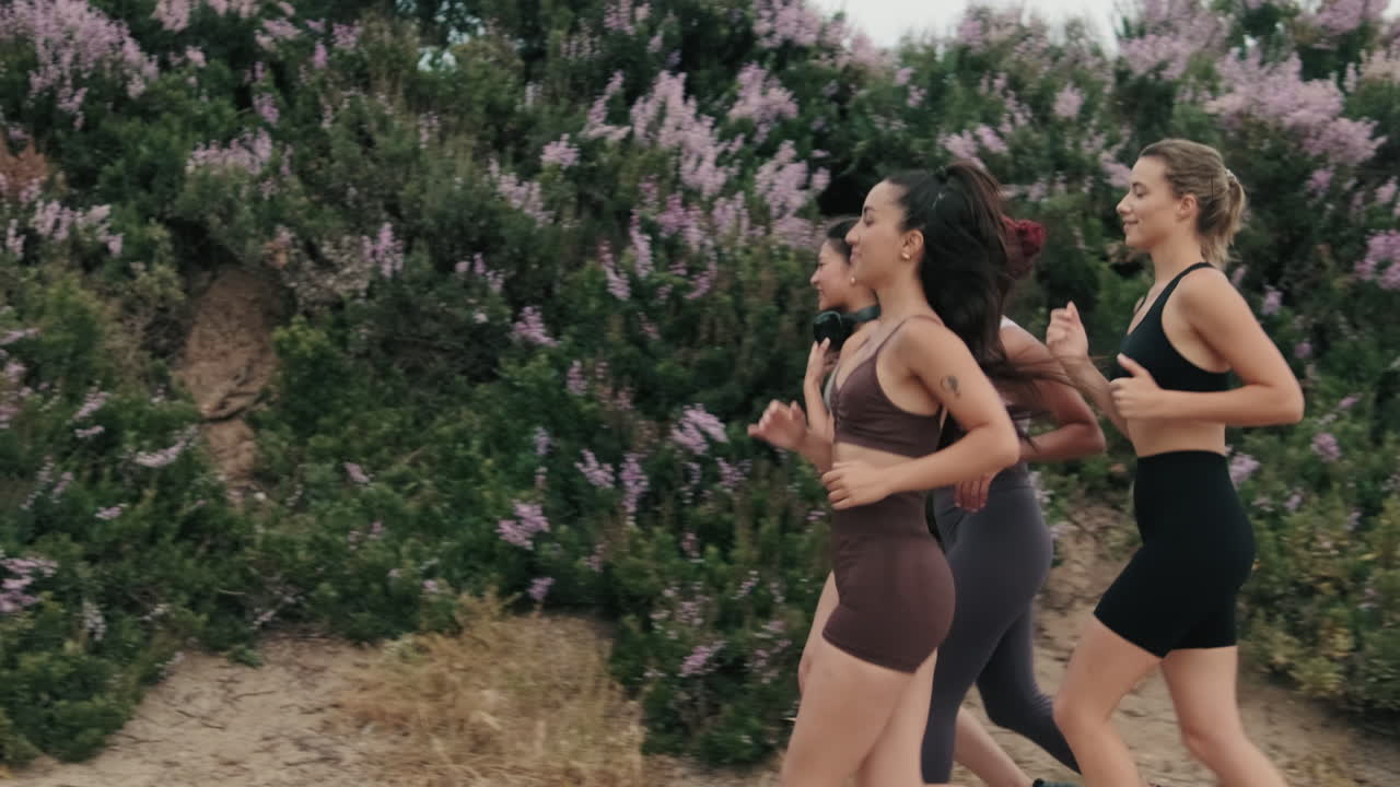 Four Women Jogging and Chatting