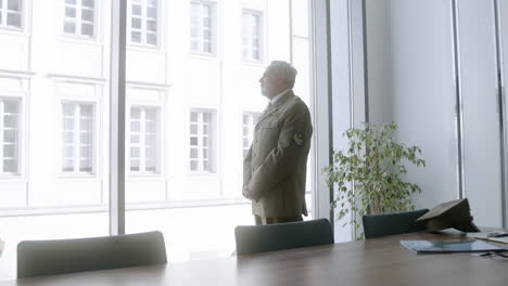 man looking out of the window