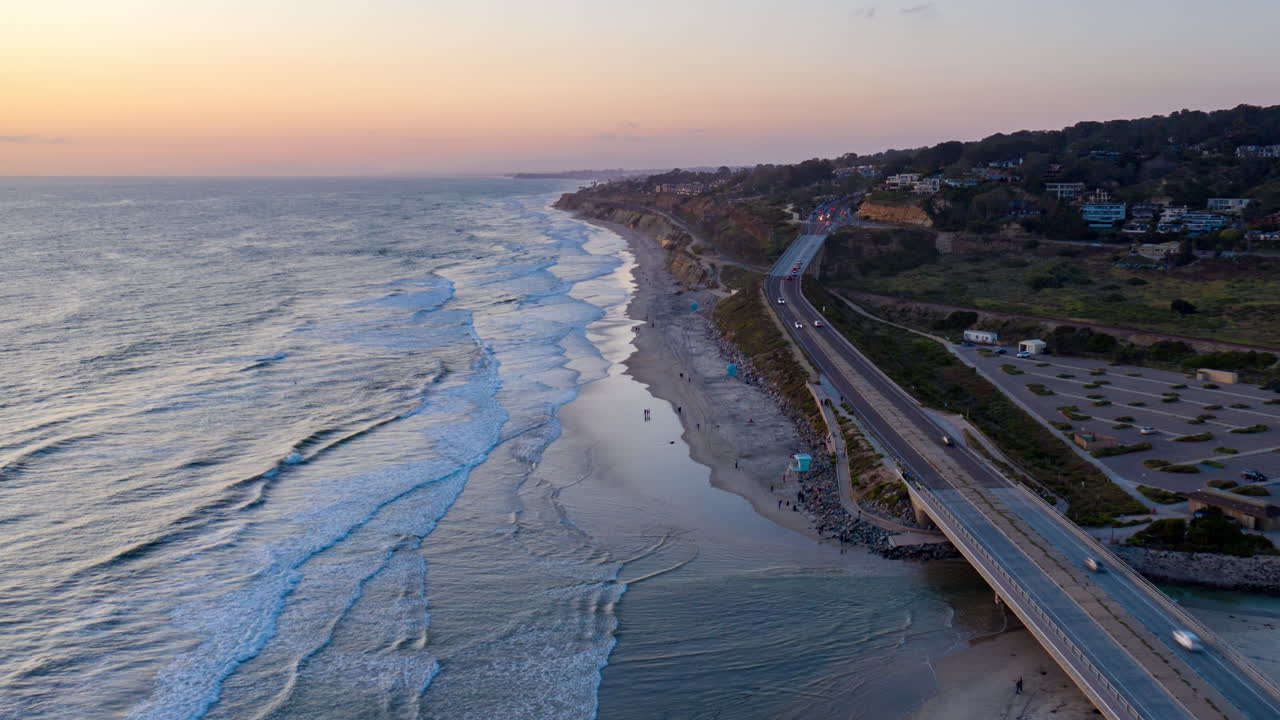 Aerial hyperlapse of the Coast Highway and bluffs leading into Del Mar, CA