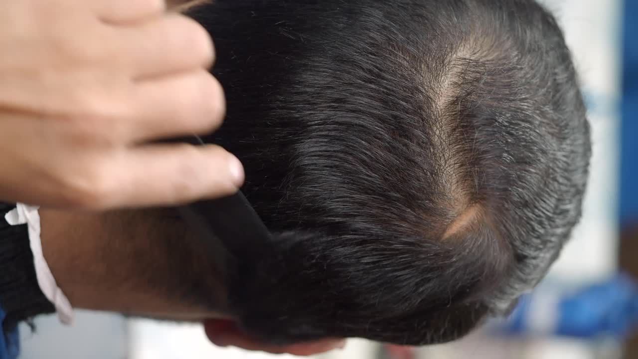 Haircut using comb and scissors