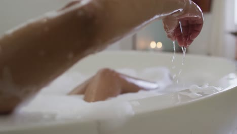 mixed race woman taking a bath