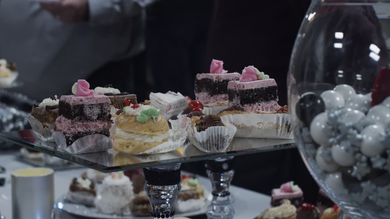 Beautifully displayed cakes on offer at a housewarming party in newly remodeled home.