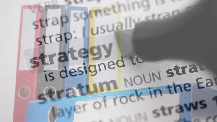 Animation of marker highlighting strategy word over binders