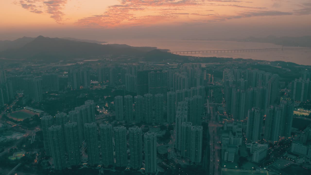drone view of a public housing area and the seaside during sunset that gives a cinematic look