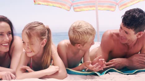 Family-discussing-on-their-towel