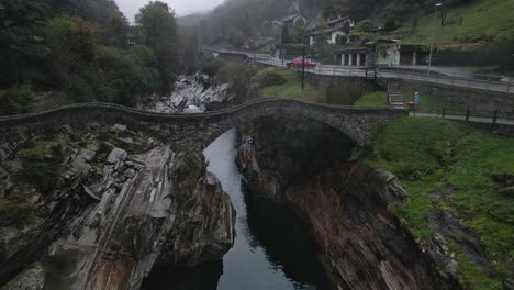 drone footage of the iconic bridge in lavertezzo, in the valle verzasca, switzerland.