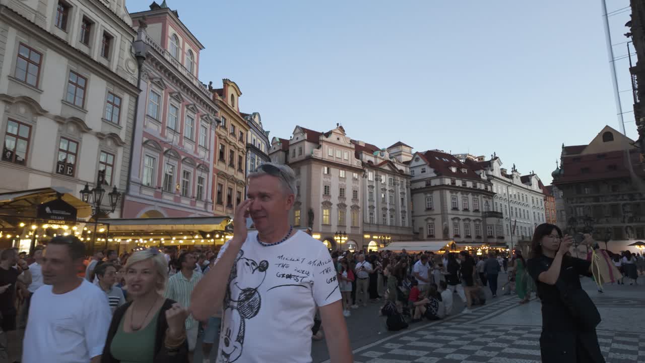 Establishing shot of Old Town Square in Prague, Czechia, featuring its historic buildings and vibrant atmosphere