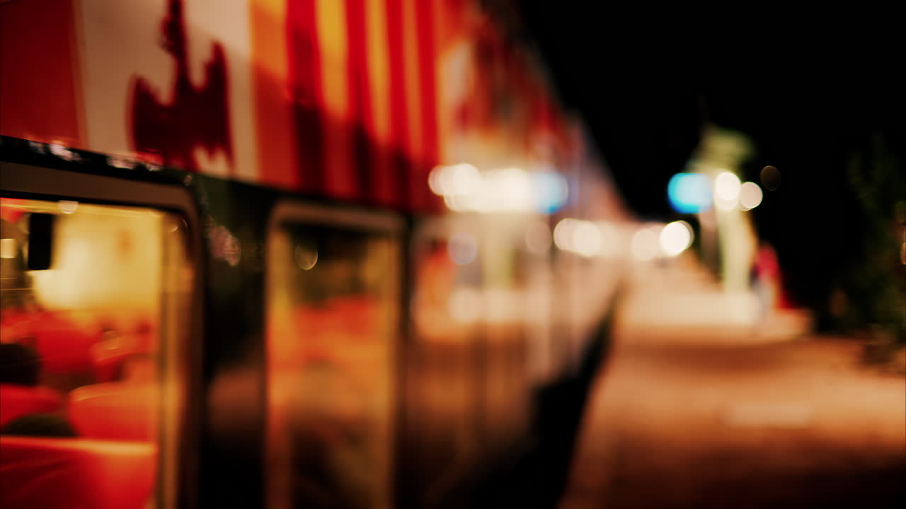 Blurry view of a train moving on the rails in the evening