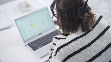 woman entering password. the computer turns on.