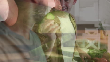 animación de manos cortando verduras sobre una pareja masculina diversa cocinando la cena en la cocina