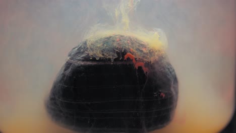 slowmotion paint floating inside water tank, beautiful layered rock. stable shot with the sony a7iii.