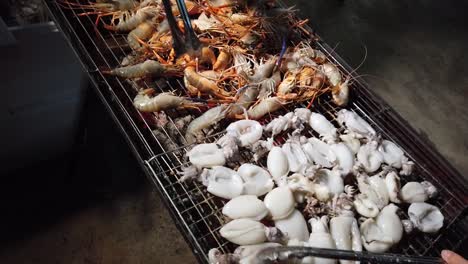 asian street vendor selling grilled seafood