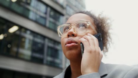 businesswoman on a phone call in the city