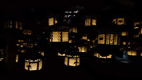 many lanterns blinking in japanese shrine