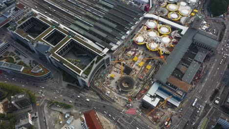 aerial of huge railroads and construction site of main train station stuttgart s21 with cranes and construction workers in stuttgart, germany