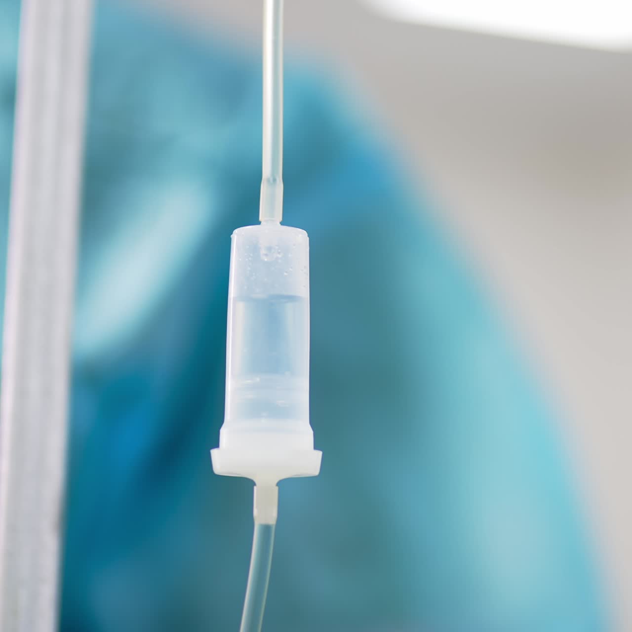 Drops of medicines dripping in the drop counter. Equipment in the surgery room during operation. Close up. Blurred backdrop