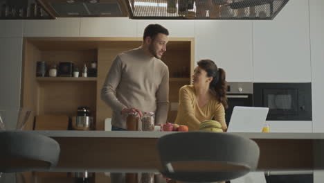 couple cooking together in modern kitchen