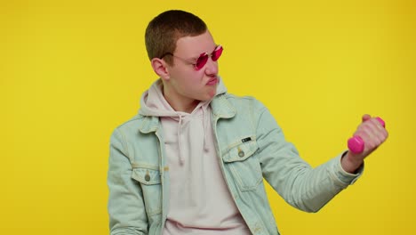 man in pink sunglasses lifting weights