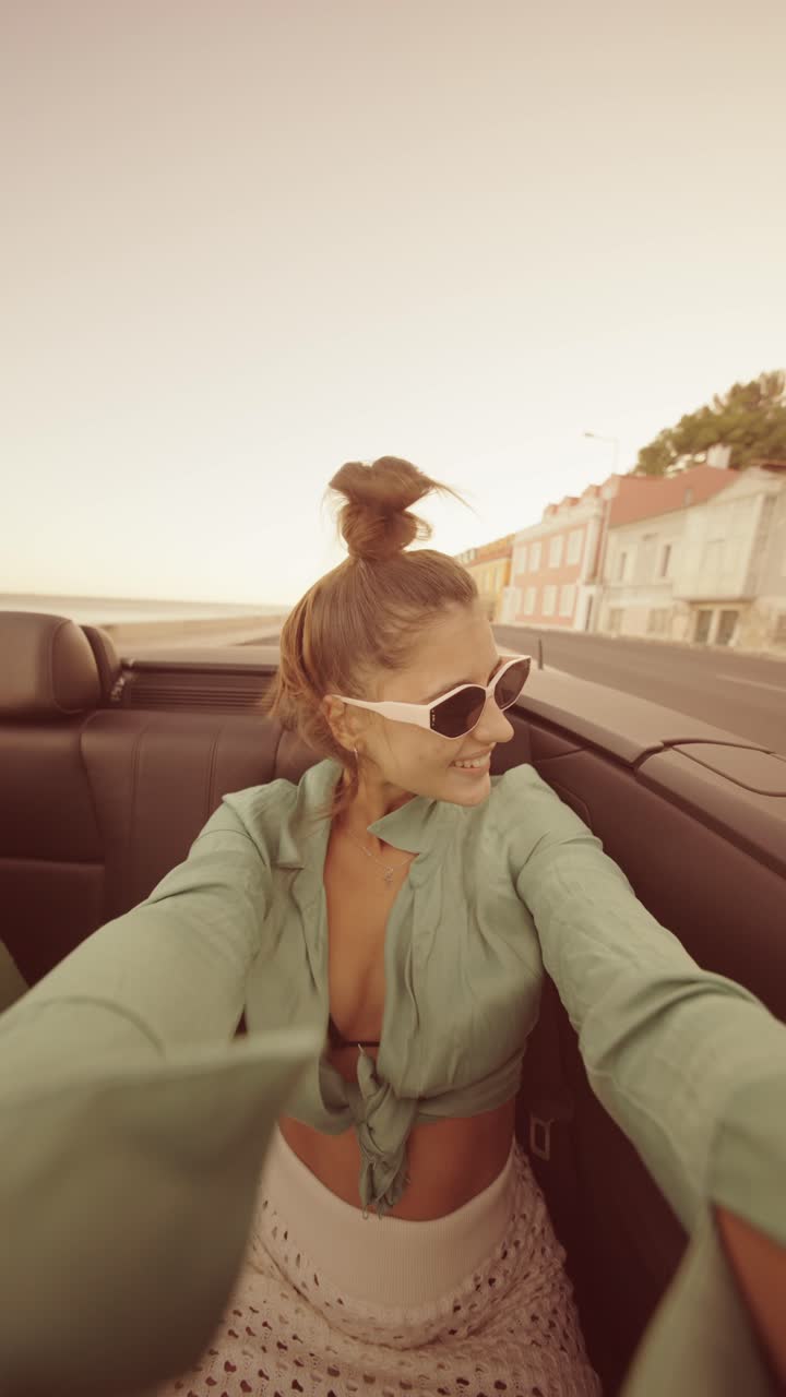 Woman enjoying a convertible ride