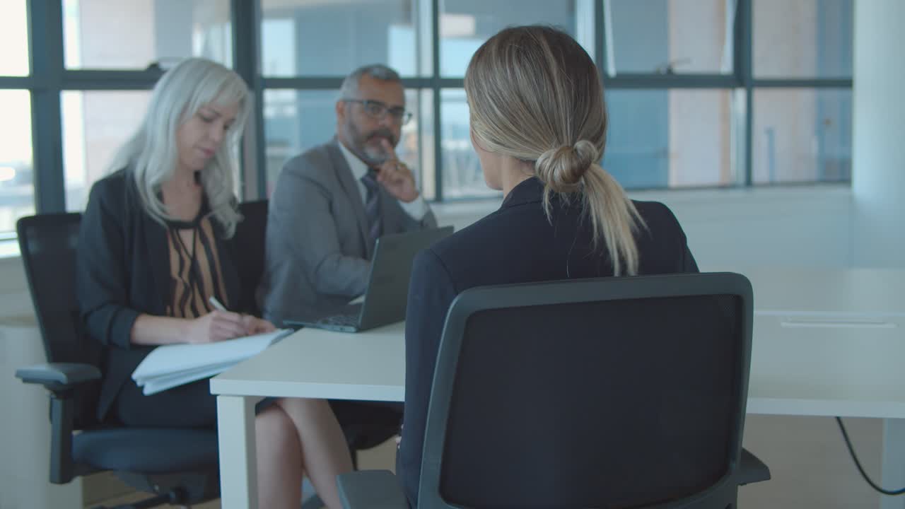 Female job candidate meeting and talking to employer