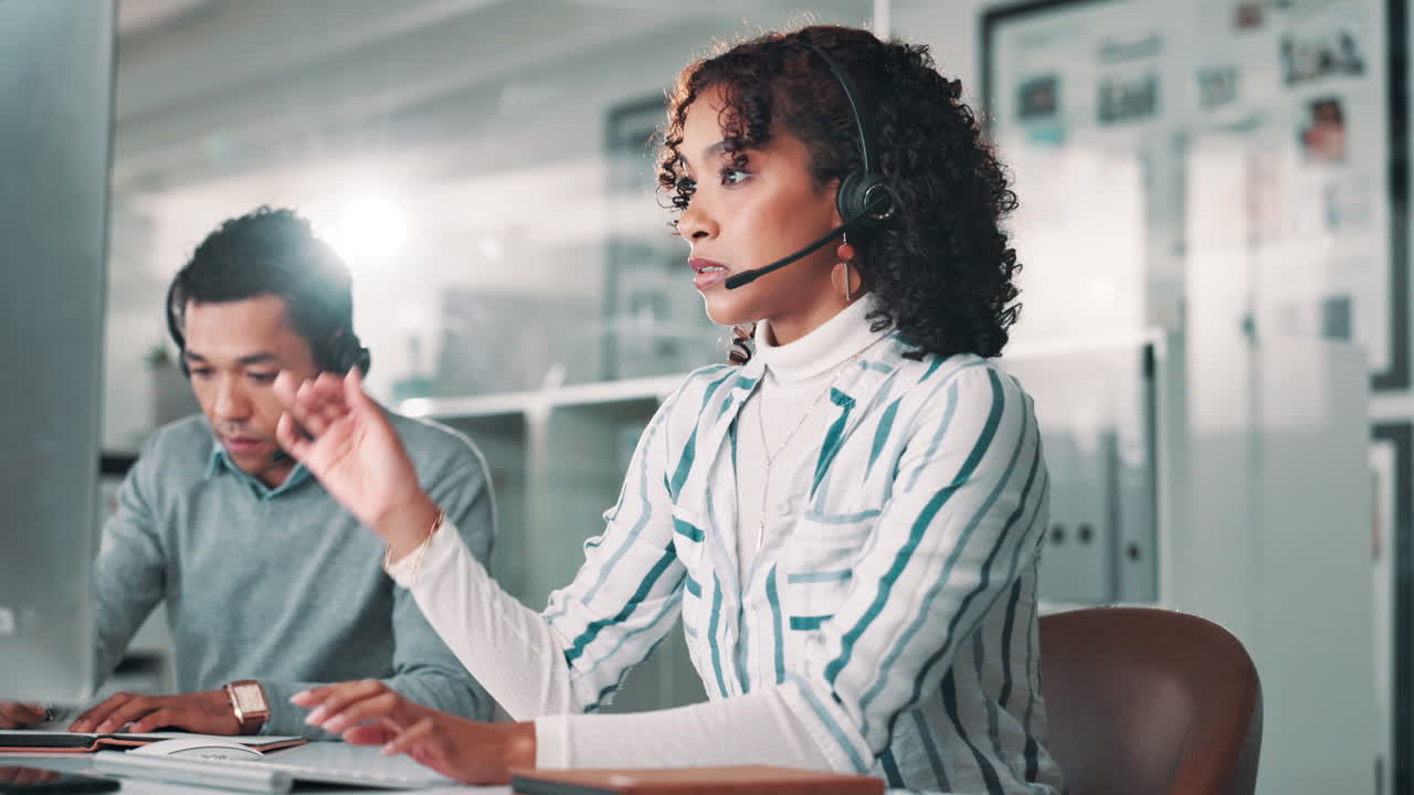 Call center agents working in office