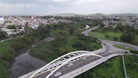 aerial footage of a river on the side of town