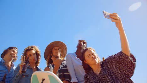 group of friends taking selfie with mobile phone 4k