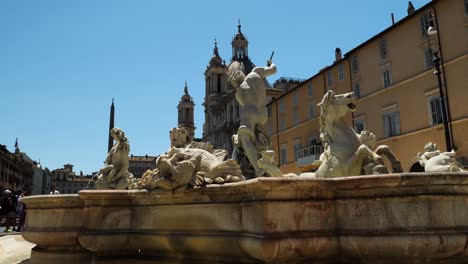 fountain of the neptune in piazza navona, in a hot summer day, rome, italy