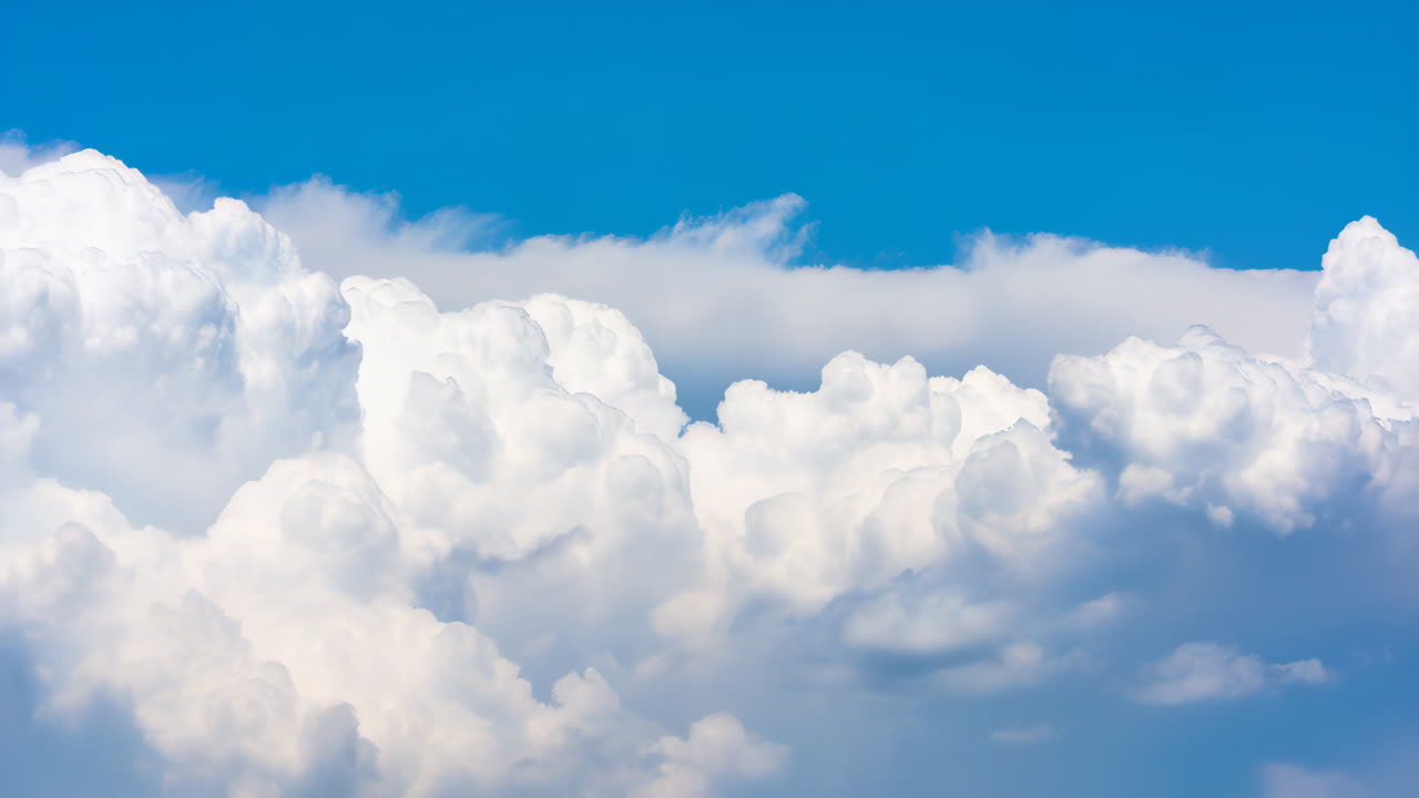 Bright Blue Sky with Fluffy White Clouds