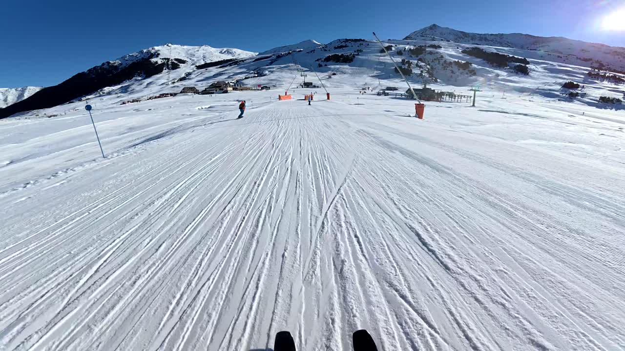 Skiing down a snowy mountain slope