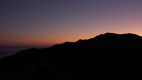 Beautiful-summer-sunset-silhouette-over-the-mountains-in-Wellington,-New-Zealand