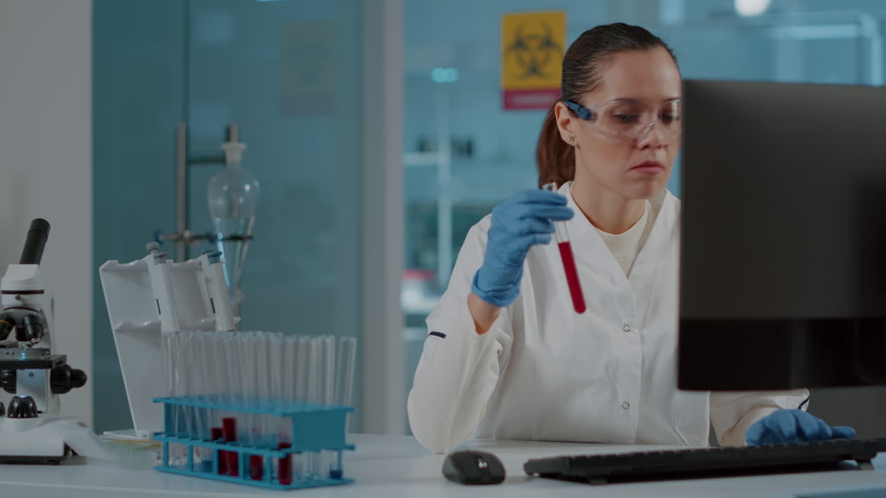 Chemistry researcher looking at substance in test tube