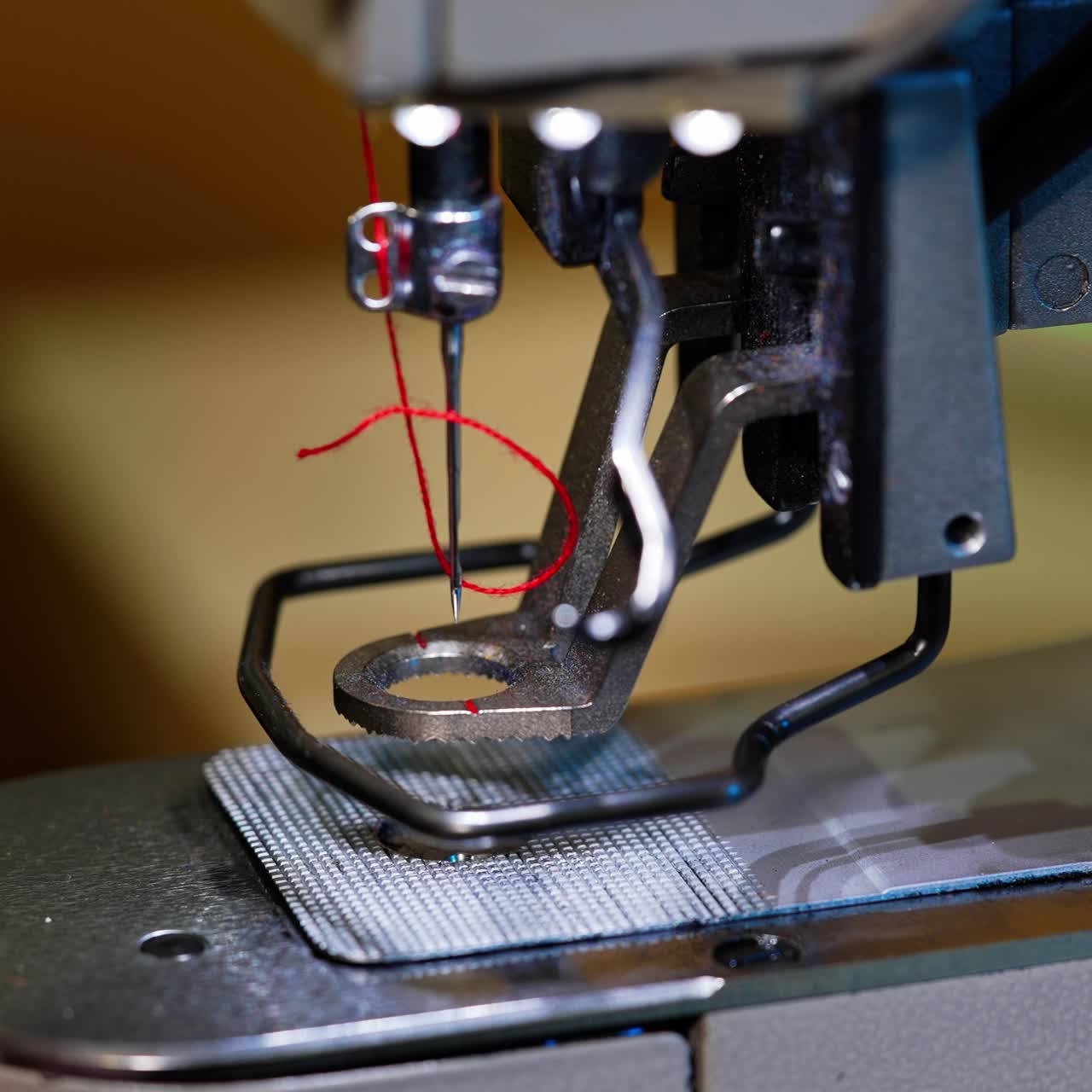 Industrial sewing machine in factory. Detail of sewing machine and sewing accessories