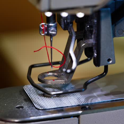 industrial sewing machine in factory. detail of sewing machine and sewing accessories