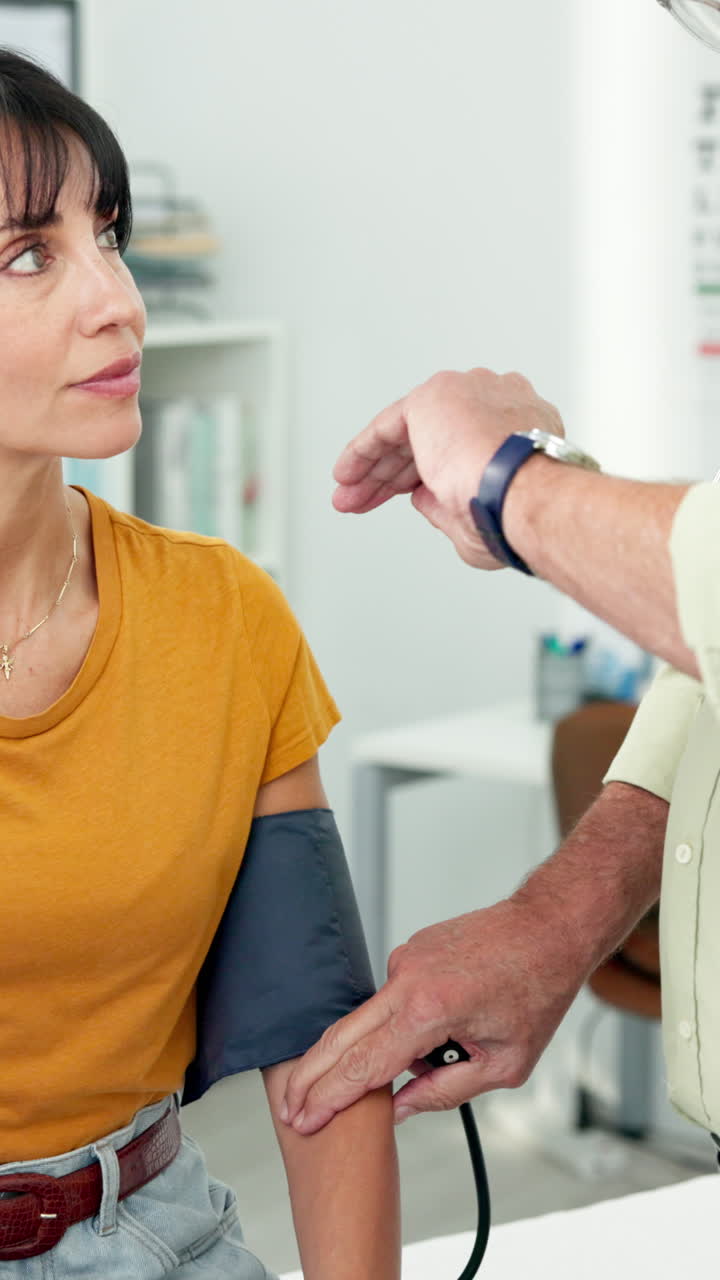 Doctor Measuring Woman's Blood Pressure During Medical Checkup