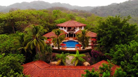 aerial shot lowering camera view of a beautiful resort and spa in tamarindo costa rica