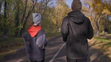 couple running in autumn park