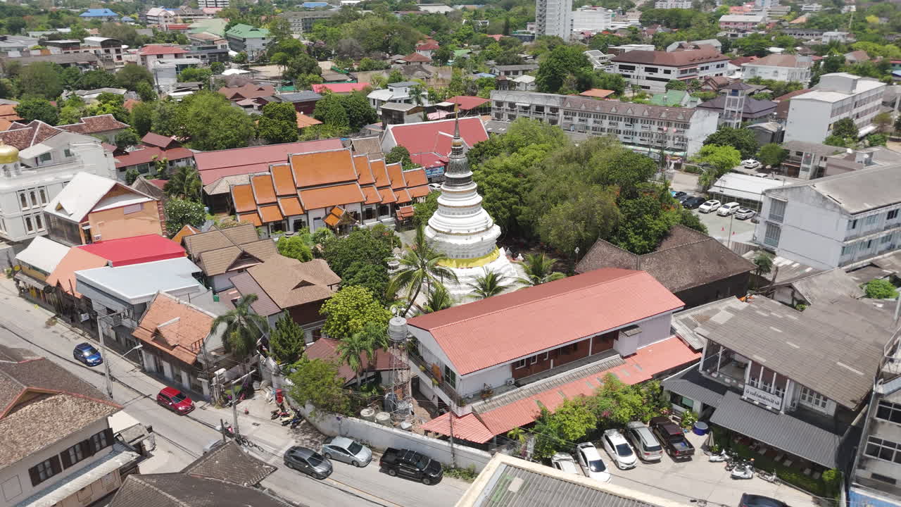 Buddhist Temple Stupa Of Wat Ket Karam Along Charoenrad Road, Muang, Chiang Mai, Thailand. Aerial Drone Shot