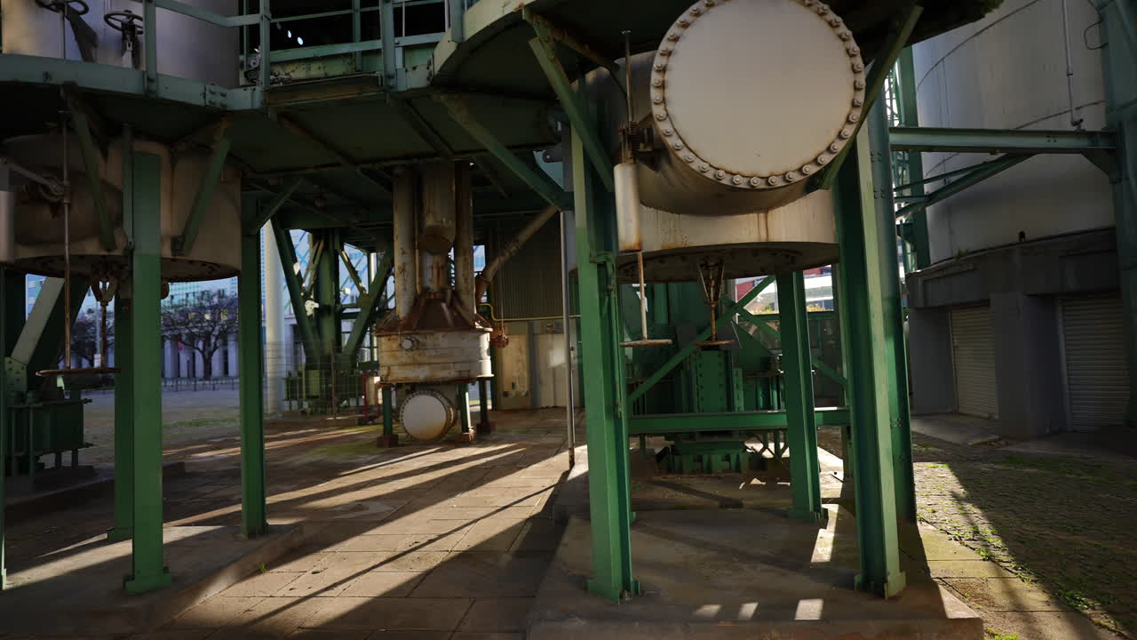 Bottom section of Chamine da Refinaria da GALP with visible pipes tanks valves and industrial details in Lisbon Parque das Nacoes