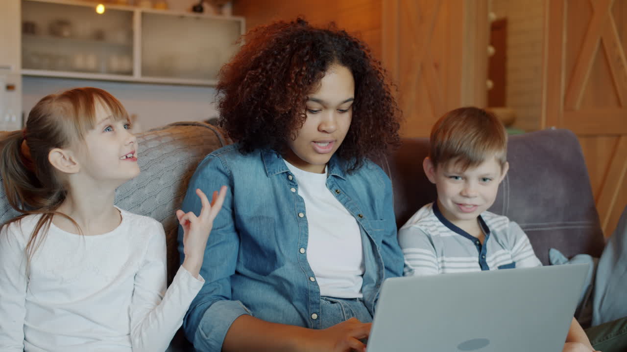 Family learning together on a laptop